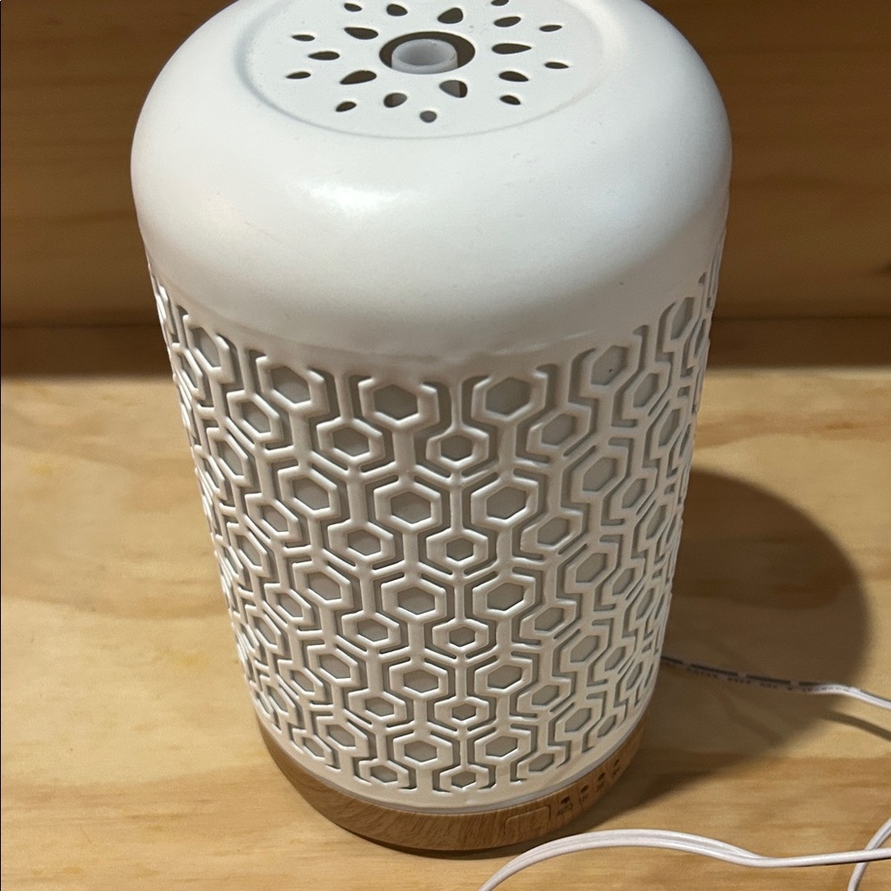 White Ceramic Aromatherapy Diffuser with a bottle of FOCUS essential oil